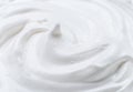 Creamy pic and waves in yoghurt or cream surface. Top view Royalty Free Stock Photo