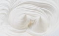 Creamy pics and swirls in yoghurt or cream surface. Top view Royalty Free Stock Photo