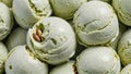 Creamy Pistachio Gelato Scoops on Display. Close-up of freshly scooped pistachio gelato arranged neatly, showcasing their texture