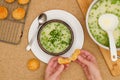 Creamy pureed celery soup with green pea. Fresh cooked vegetable soup in a bowl served with cheese bread close-up directly from Royalty Free Stock Photo