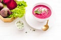 Creamy red beetroot soup with raw beets and sour cream Royalty Free Stock Photo