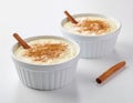 Creamy Rice Pudding with Cinnamon in White Ramekins Royalty Free Stock Photo