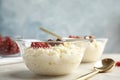 Creamy rice pudding with red currant and hazelnuts in bowl served Royalty Free Stock Photo