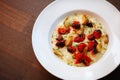 Creamy risotto with roasted cherry tomatoes and garlic
