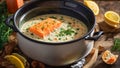 Creamy soup pieces salmon, lemon, dill dinner an old background fresh fish healthy meal
