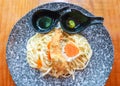 Creamy spaghetti pasta with prawn tempura and salted duck egg searved with wasabi shoyu sauce