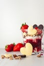 Strawberry valentine's day dessert decorated with heart-shaped chocolate and ripe berries vertical photo Two glasses Royalty Free Stock Photo