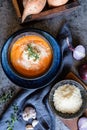 Creamy Sweet potato soup topped with Pecorino cheese, roasted cashew nuts and fresh thyme Royalty Free Stock Photo