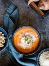 Creamy Sweet potato soup topped with Pecorino cheese, roasted cashew nuts and fresh thyme Royalty Free Stock Photo