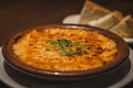 Creamy Tokyo Style Lasagna served in a brown china bowl with bread