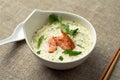 Creamy tom kha Thai soup with salmon
