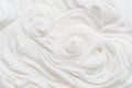 Creamy waves and swirls in yoghurt or cream surface. Top view Royalty Free Stock Photo