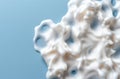 Creamy white foam texture on blue background Royalty Free Stock Photo