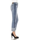 Crease & Clips Slim Women`s Light Blue Jeans, Woman in Blue tight jeans with white heels, white background