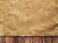 Creased handmade paper sheet on wooden wall background Royalty Free Stock Photo