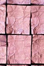 Creased Pink Aluminum foil Squares on black Background