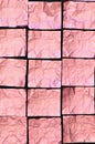 Creased Pink Aluminum foil Squares on black Background