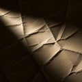 Creased and textured brown paper in low lighting, displaying a network of intersectin Royalty Free Stock Photo