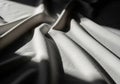 Creased white fabric with a smooth texture, displaying a subtle interplay of light and shadow Royalty Free Stock Photo