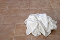 Creased white towels on ceramic floor Royalty Free Stock Photo