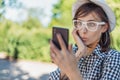 Creasy young girl taking selfie. Close-up of a astonished