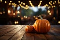 Create eerie presentations on a wooden table with a Halloween pumpkin