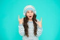 Create feel-good playlist. music mood. little child knitted sweater and hat. musical suggestions for winter playlist