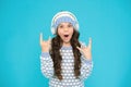 create feel-good playlist. music mood. little child knitted sweater and hat. musical suggestions for winter playlist