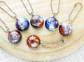 Create galaxy drink coasters using resin, glitter and pigment powders, handmade items. Suitable for keychains