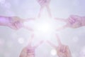 Create idea of hand is star shape with white sun light on bokeh background Royalty Free Stock Photo