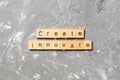 Create innovate word written on wood block. Create innovate text on cement table for your desing, Top view concept Royalty Free Stock Photo