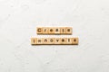 Create innovate word written on wood block. Create innovate text on cement table for your desing, Top view concept Royalty Free Stock Photo