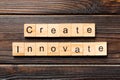 Create innovate word written on wood block. Create innovate text on wooden table for your desing, Top view concept Royalty Free Stock Photo