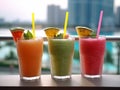 a photo of three juice drinks, watermelon juice, mango juice, and pineapple juice, each in a transparent glass with a straw.Genera