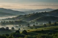 Create a tranquil mountain range with rolling hills, painted in layers of muted green and blue, enveloped by a thin mist Royalty Free Stock Photo