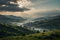 Create a tranquil mountain range with rolling hills, painted in layers of muted green and blue, enveloped by a thin mist Royalty Free Stock Photo