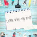 Create what you want against tools and notepad on wooden background