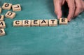 Create. Wooden blocks on a green chalk board Royalty Free Stock Photo