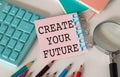 Create Your Future text quote on a pink card, Business Concept on Blue Background Royalty Free Stock Photo