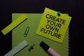 Create Your Own Future write on Sticky Notes. Top view isolated on black background Royalty Free Stock Photo