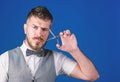 Create your style. Macho bearded barber hold scissors cut hair. Barbershop service concept. Businessman strict face hold