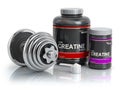 Creatine powder with scoop and dumbbell.Bodybuilder nutritionsu