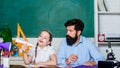 Creating a community of learners. Teacher and schoolgirl. Man bearded pedagogue and pupil having fun. Developing caring Royalty Free Stock Photo