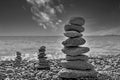 Creating a composition by stacking stones at the seaside Royalty Free Stock Photo