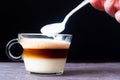 Creating a Cuban Coffee, spooning foamed milk on top