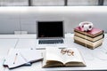 Creating effective study space. Laptop, textbooks, notes and music for univesity student.