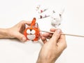 Creating a handmade toy. Cheerful wadding toy cats by handmade Royalty Free Stock Photo