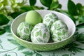 Bowl of eggs with green leaf patterns and solid green color, on a green leaf-patterned background, symbolizing nature Royalty Free Stock Photo