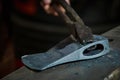 Creating iron tools in blacksmith`s on the old plank wood table Royalty Free Stock Photo