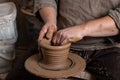 Creating a pot of clay close-up. Hands making products from clay. Potter at work Royalty Free Stock Photo